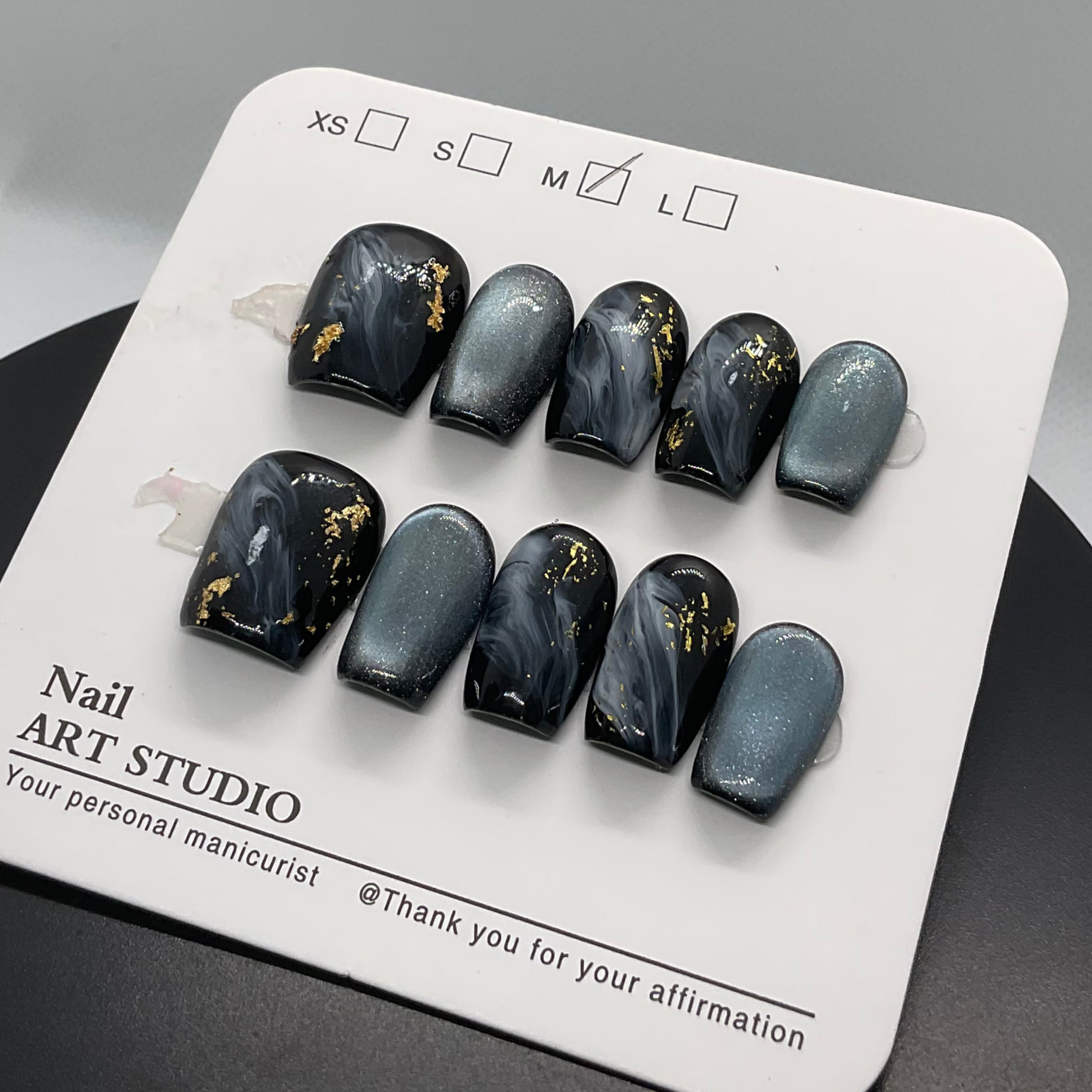 Bold, glossy black press-on nails with a luxe shine.