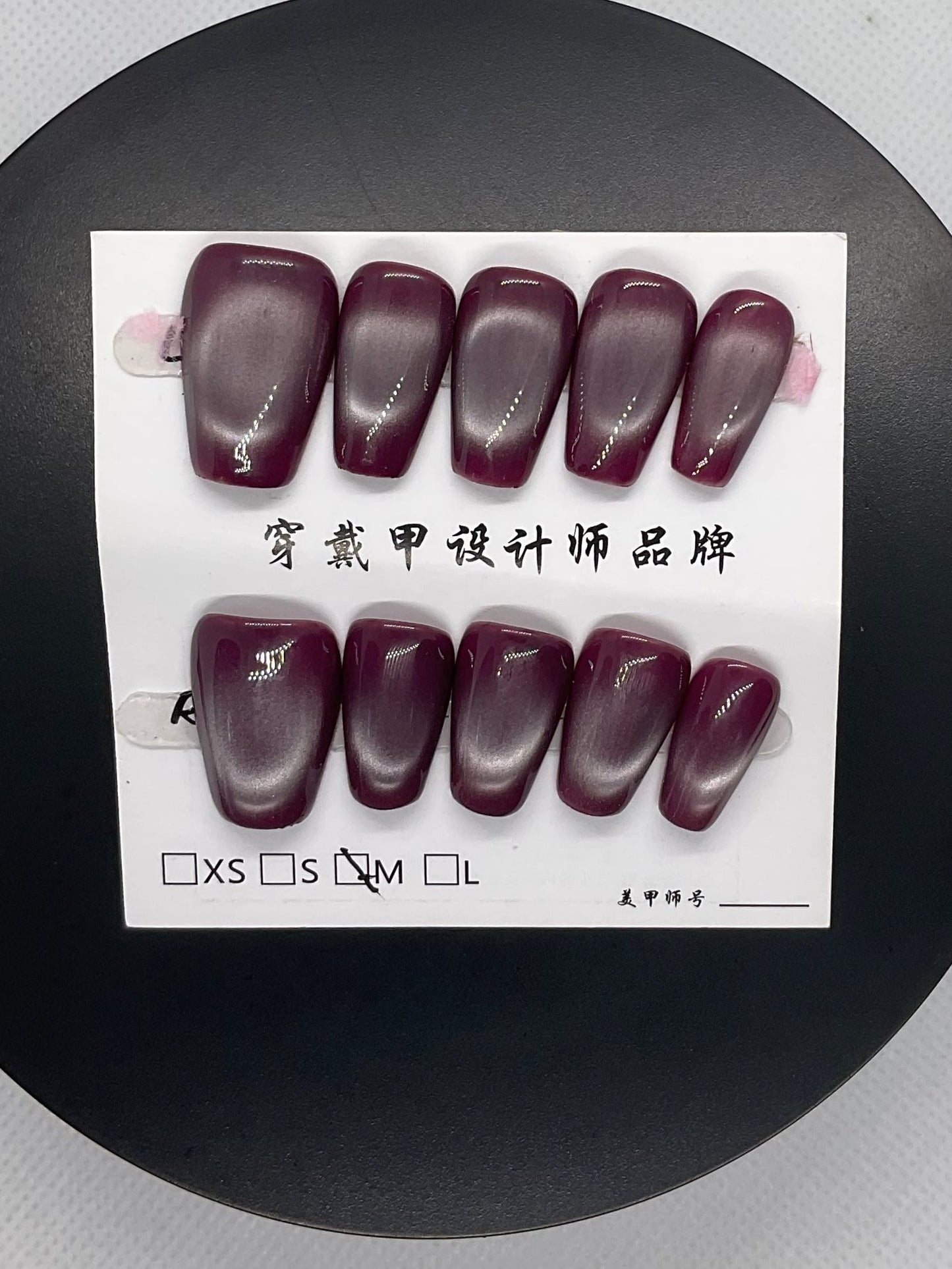 Deep plum nails with a sultry allure, perfect for bold evenings.
