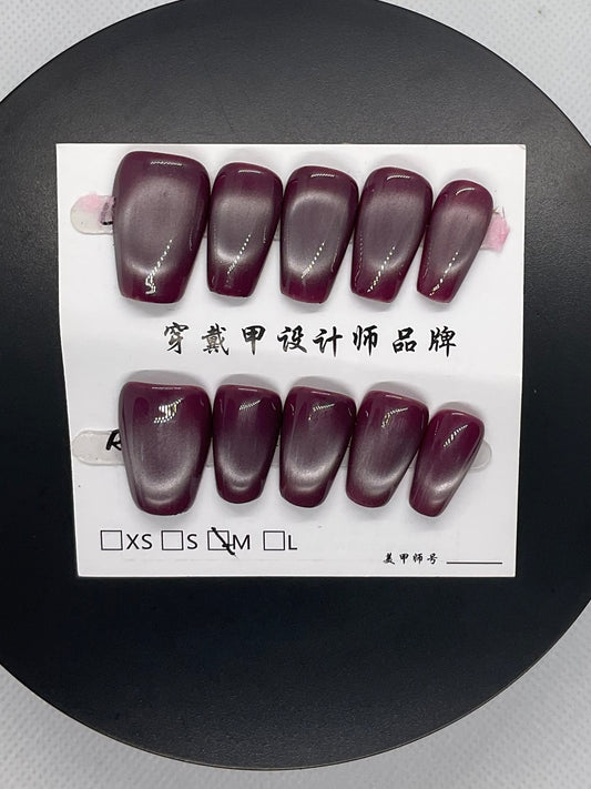 Deep plum nails with a sultry allure, perfect for bold evenings.